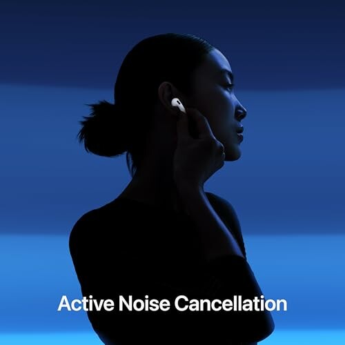 Silhouette of a woman using earbuds with active noise cancellation