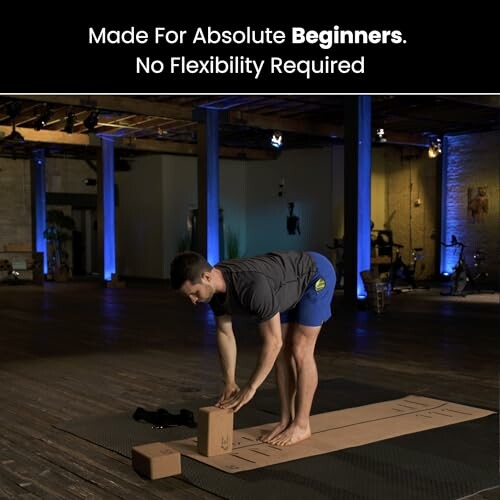 Man in yoga pose with blocks, suitable for beginners.
