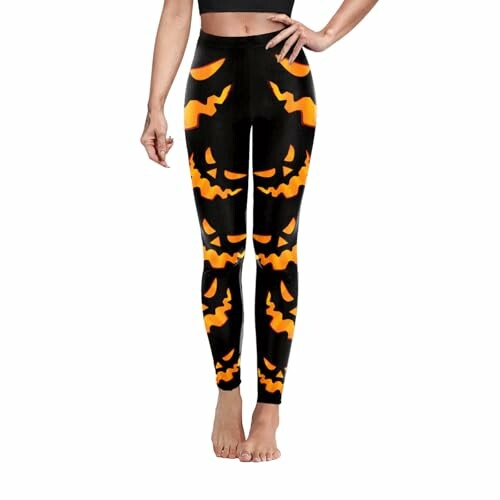Black leggings with orange pumpkin faces design.